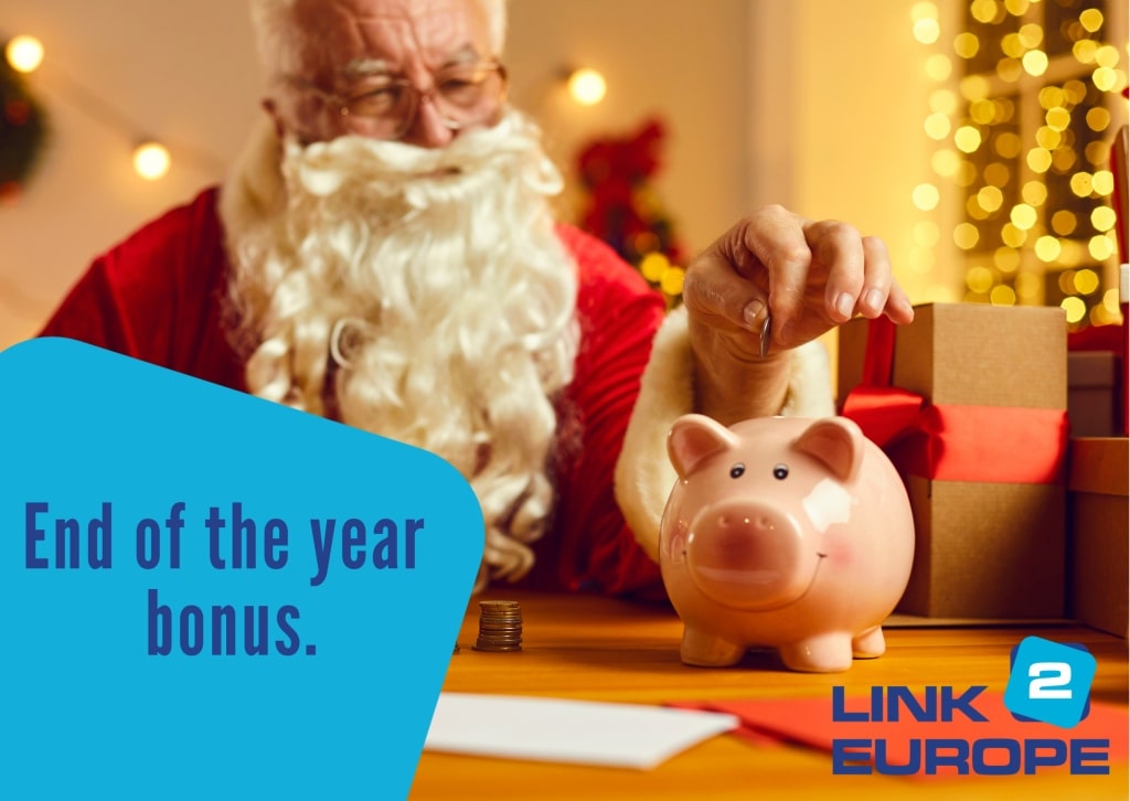 Father Christmas puts money in a piggy bank.
